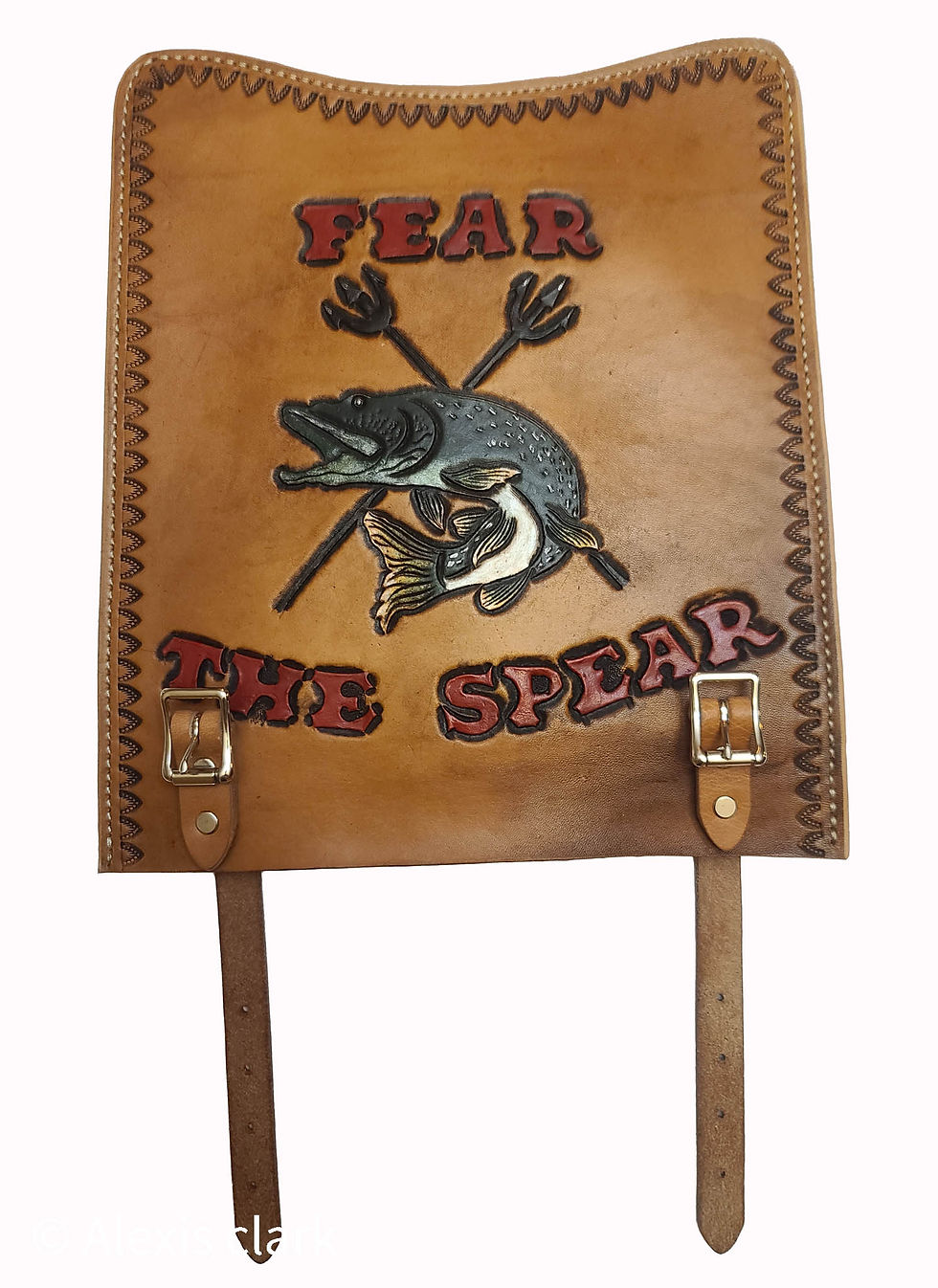 leather spear cover with a carved and painted northern pike fish and the words" fear the spear"