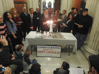 Governor Gina Raimondo lights Hanukah Candles at the State House