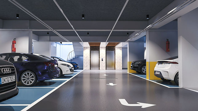 The image shows a clean, modern, and well-lit underground parking garage_edited.jpg