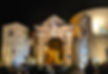 large arched door at the gates of San Francesco of Penne lit up at night