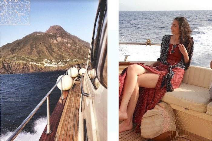 a happy woman on a boat headed for the island of Stromboli