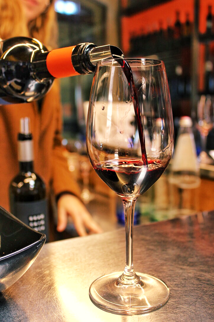 Red wine being served at hidden wine experience in Tuscany