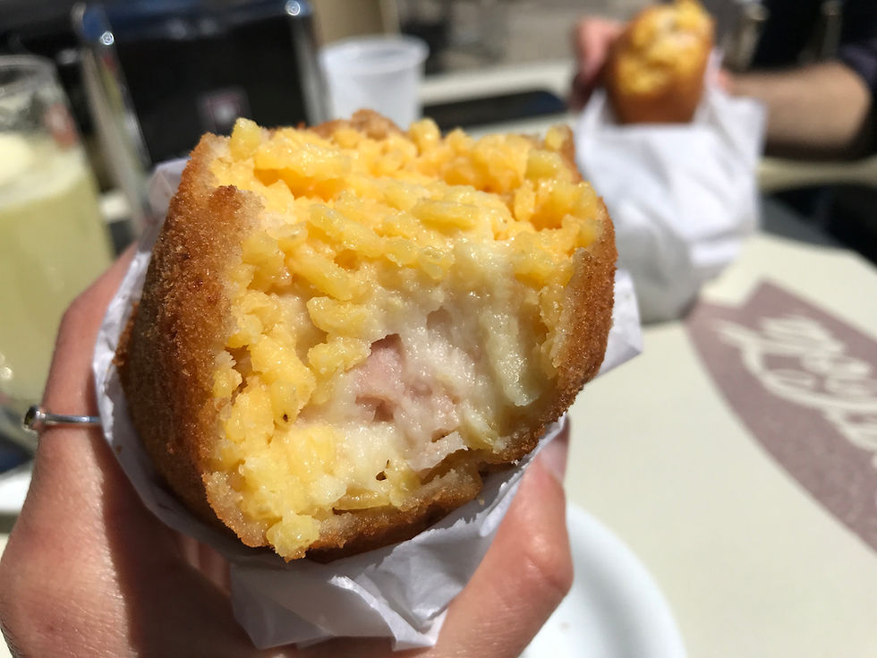sicilian arancino rice ball fried and filled with cheese and ham