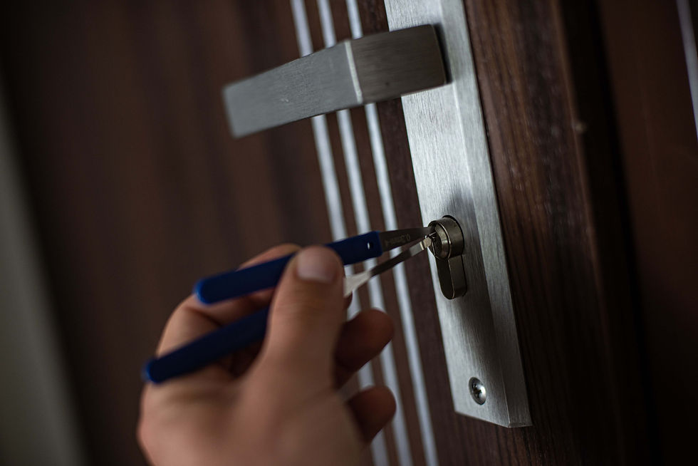 Locksmith picking home door lock