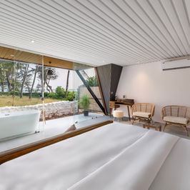 These beautifully renovated, king-sized contemporary rooms are part of our stunning new A-frame huts. Situated on the ground floor, these are our most premium and largest rooms. They offer a partial sea view. Each hut features a bathtub on the balcony 
By booking directly through our official website, you’ll enjoy special discounted rates. 

Your stay includes a complimentary breakfast with breathtaking sea views