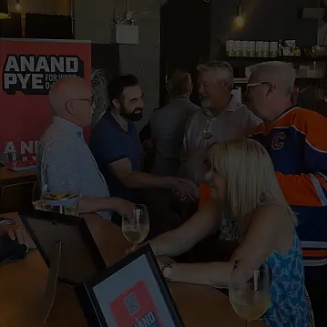 Anand Pye connecting with residents at a local fundraiser in the Oliver neighborhood