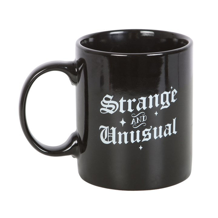 Black mug: "Strange & Unusual"