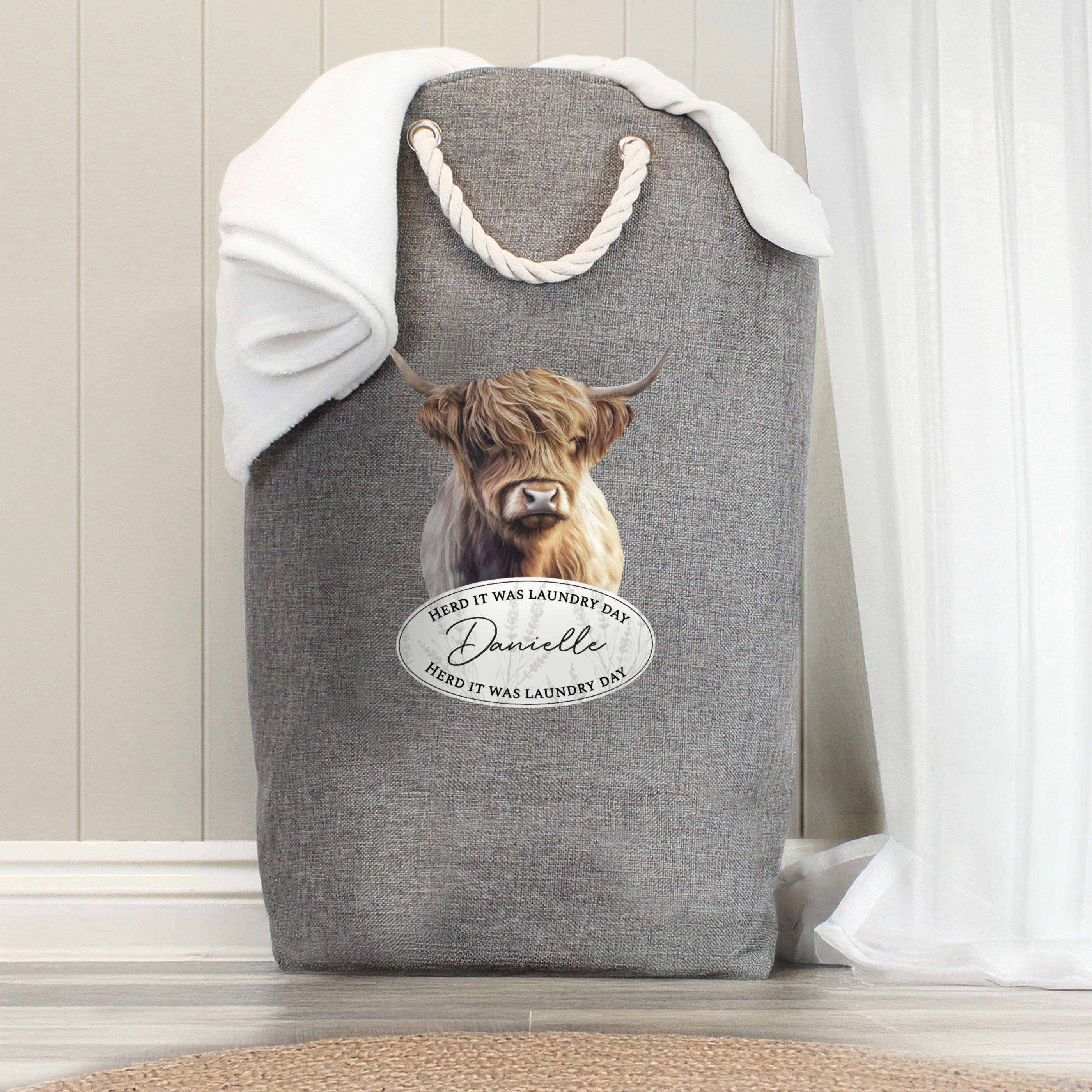 Grey Highland Cow laundry hamper, personalized with Danielle