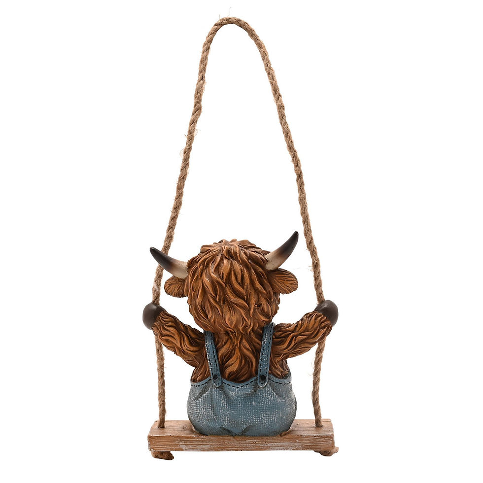 Thumbnail: Country Living Highland Cow On A Swing