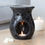 Thumbnail: Black mosaic oil burner with lit candle