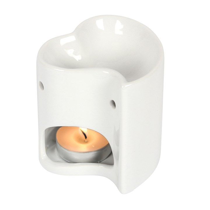 White heart-shaped ceramic incense burner with a tea light