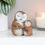 Thumbnail: Mother owl figurine cradling baby owl