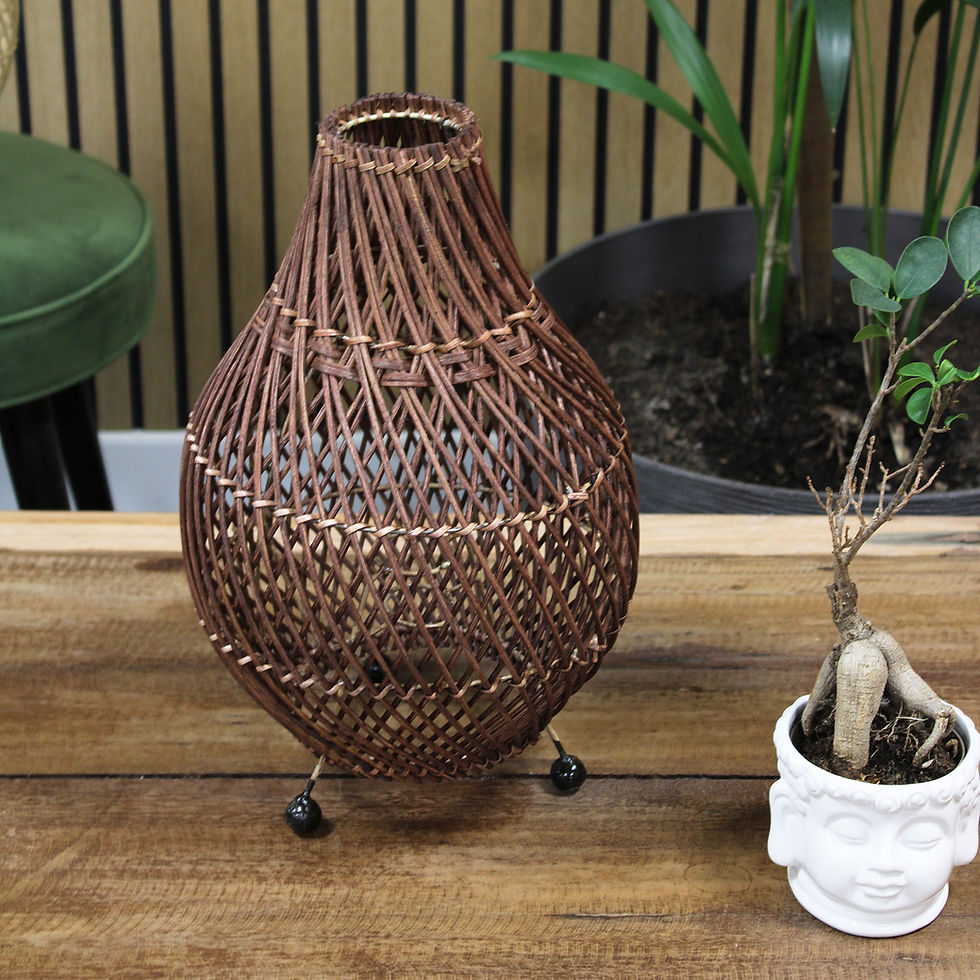 Thumbnail: Brown wicker vase on wooden table
