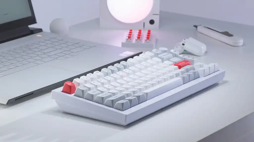 A close-up of a Keychron Keyboard, featuring mechanical keys and RGB lighting.