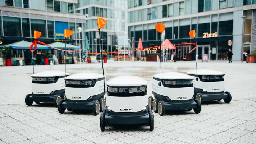 Grocery robots navigating the store shelves to assist customers.
