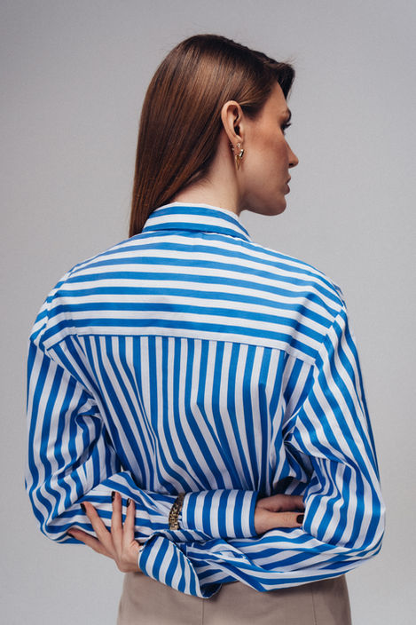 Back view fashion lookbook photograph featuring blue striped shirt