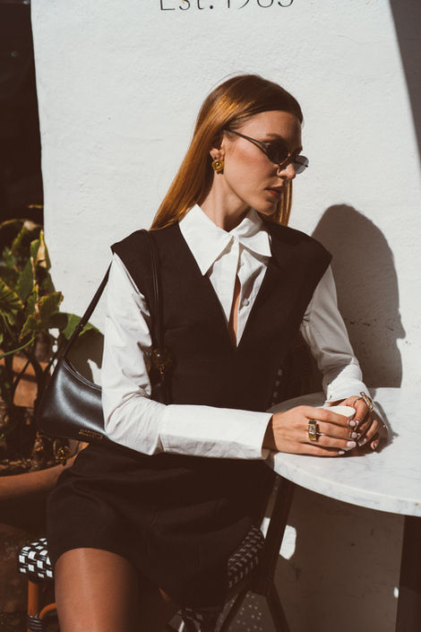 Street style fashion portrait featuring tailored dress and sunglasses