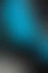 Blue McLaren supercar with butterfly doors open outside modern home