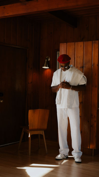 Editorial portrait in a wood-paneled interior with warm lighting
