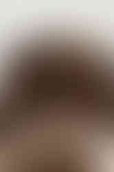 Low angle fashion editorial photograph highlighting textured sweater and tights styling