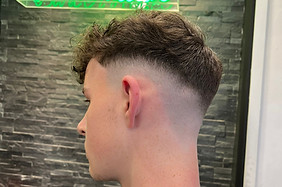 mid skin fade curly top