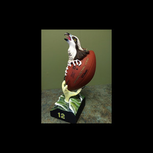 Hand-carved Seattle Seahawks inspired wooden sculpture featuring osprey head and football