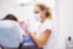 dentist-examining-female-patient