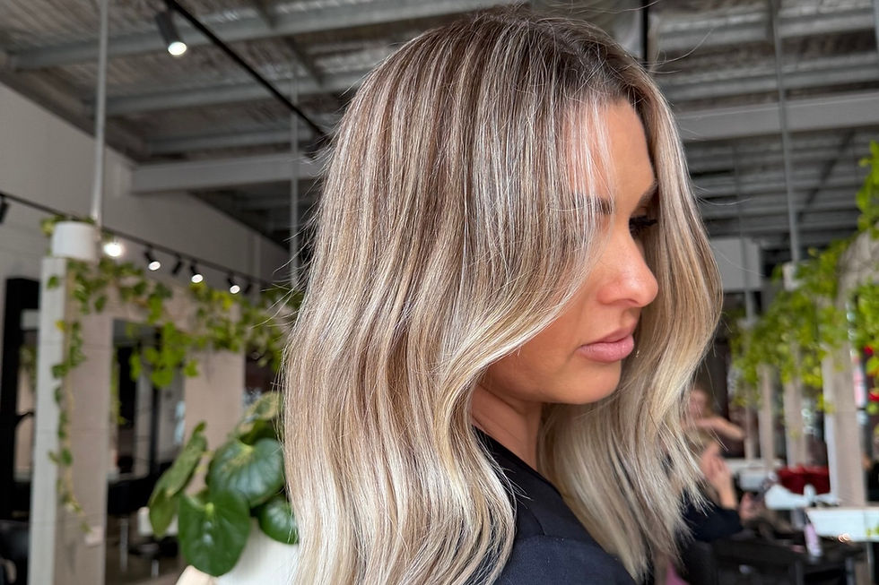 Keratin Alpha Sleek treatment being applied to client’s hair