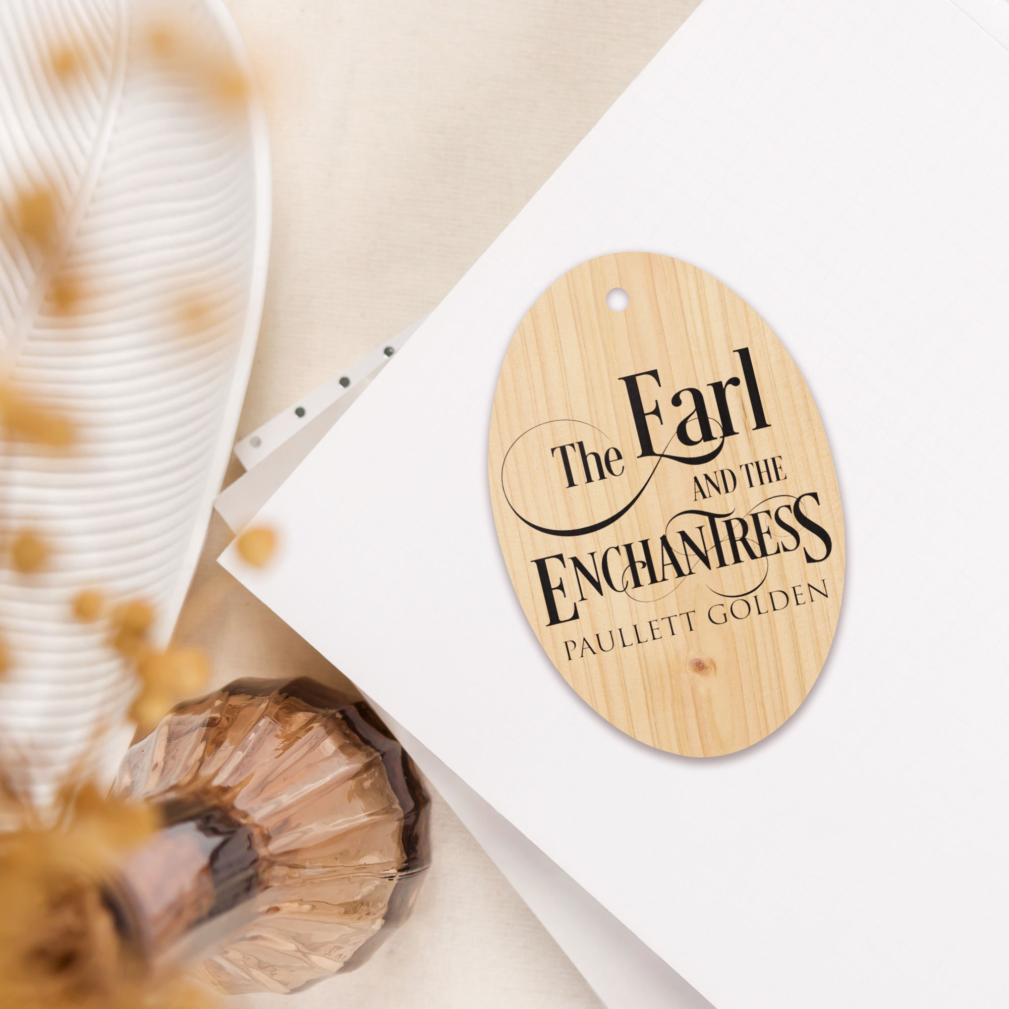 black and white novel title reading "The Earl and The Enchantress"