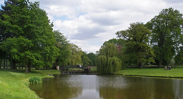 a lake with bridge and trees