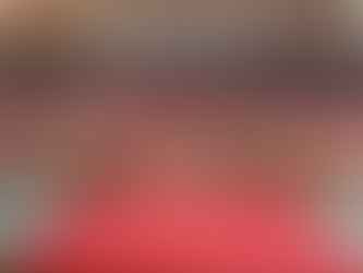 late summer wedding flowers arranged in front of the church alter, featuring sunflowers, cerise roses, Dahlias, and warm orange blooms