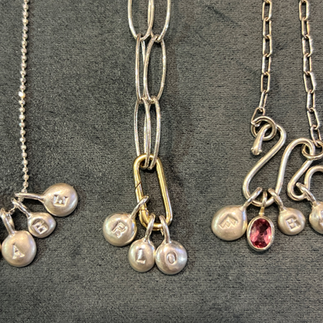 3 charm necklaces with yellow gold charm holder on silver chain