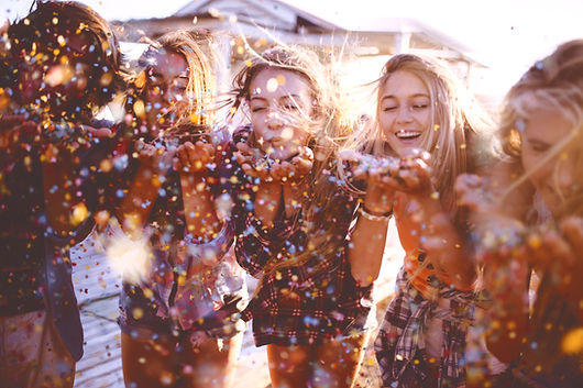 Friends blowing confetti_edited.jpg