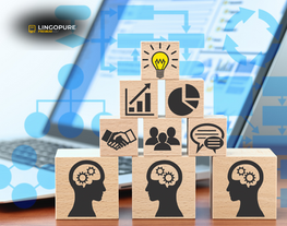 Các khối gỗ xếp hình với biểu tượng giao tiếp, nhóm, biểu đồ và ý tưởng, minh họa cho việc giao tiếp là nền tảng cho mọi kỹ năng trong học tập CEFR từ A2 đến B2 tại LingoPure.