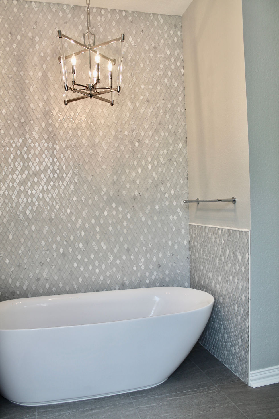 Freestanding Tub, Storage, White Cabinets, Hamper in Vanity, Mosaic Wall Tile, Polished Nickel Fixtures, Quartzite Countertops, Natural Stone Countertops, Large Format Floor Tile, Curbless Shower, Grab Bars, Hidden Shower Niche, Large Custom Mirrors, Sconces, Vanity, Make Up area, Storage, Drawers under Sink, Shower Body Sprayers