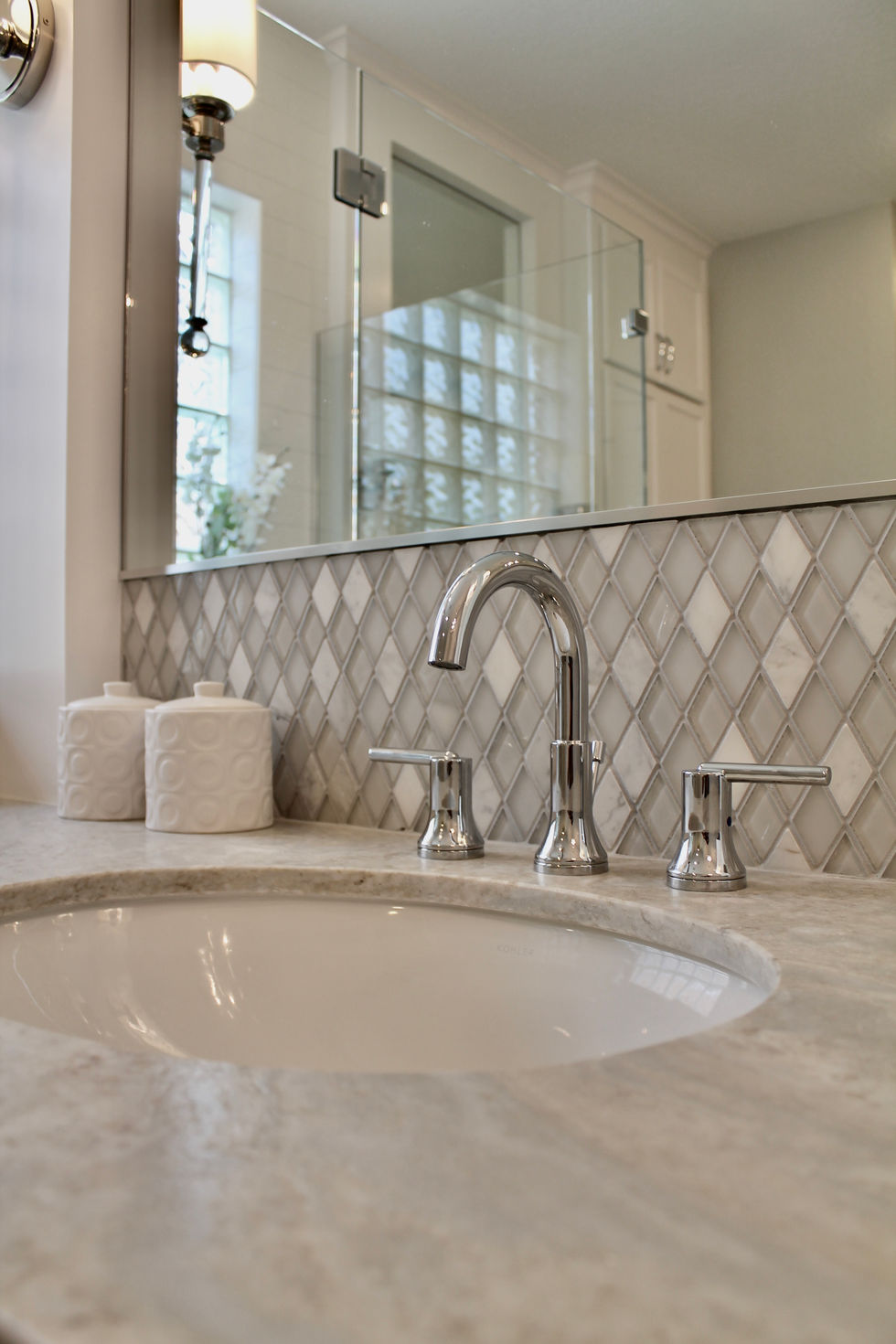 Freestanding Tub, Storage, White Cabinets, Hamper in Vanity, Mosaic Wall Tile, Polished Nickel Fixtures, Quartzite Countertops, Natural Stone Countertops, Large Format Floor Tile, Curbless Shower, Grab Bars, Hidden Shower Niche, Large Custom Mirrors, Sconces, Vanity, Make Up area, Storage, Drawers under Sink, Shower Body Sprayers