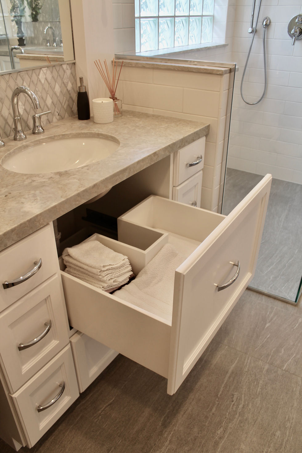 Freestanding Tub, Storage, White Cabinets, Hamper in Vanity, Mosaic Wall Tile, Polished Nickel Fixtures, Quartzite Countertops, Natural Stone Countertops, Large Format Floor Tile, Curbless Shower, Grab Bars, Hidden Shower Niche, Large Custom Mirrors, Sconces, Vanity, Make Up area, Storage, Drawers under Sink, Shower Body Sprayers