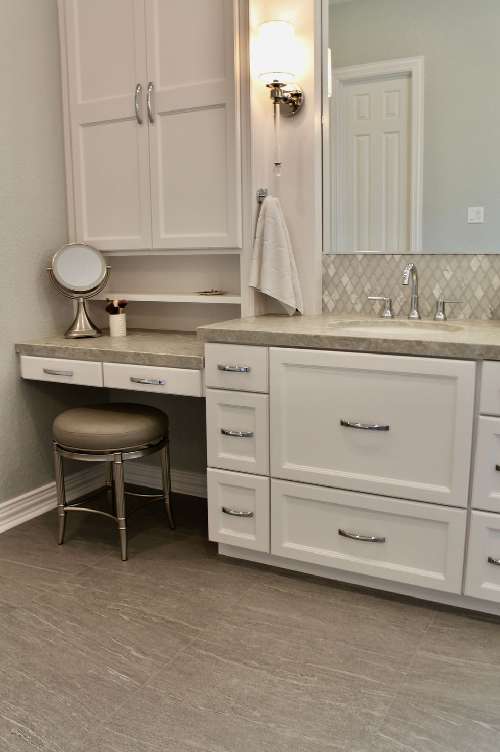 Freestanding Tub, Storage, White Cabinets, Hamper in Vanity, Mosaic Wall Tile, Polished Nickel Fixtures, Quartzite Countertops, Natural Stone Countertops, Large Format Floor Tile, Curbless Shower, Grab Bars, Hidden Shower Niche, Large Custom Mirrors, Sconces, Vanity, Make Up area, Storage, Drawers under Sink, Shower Body Sprayers