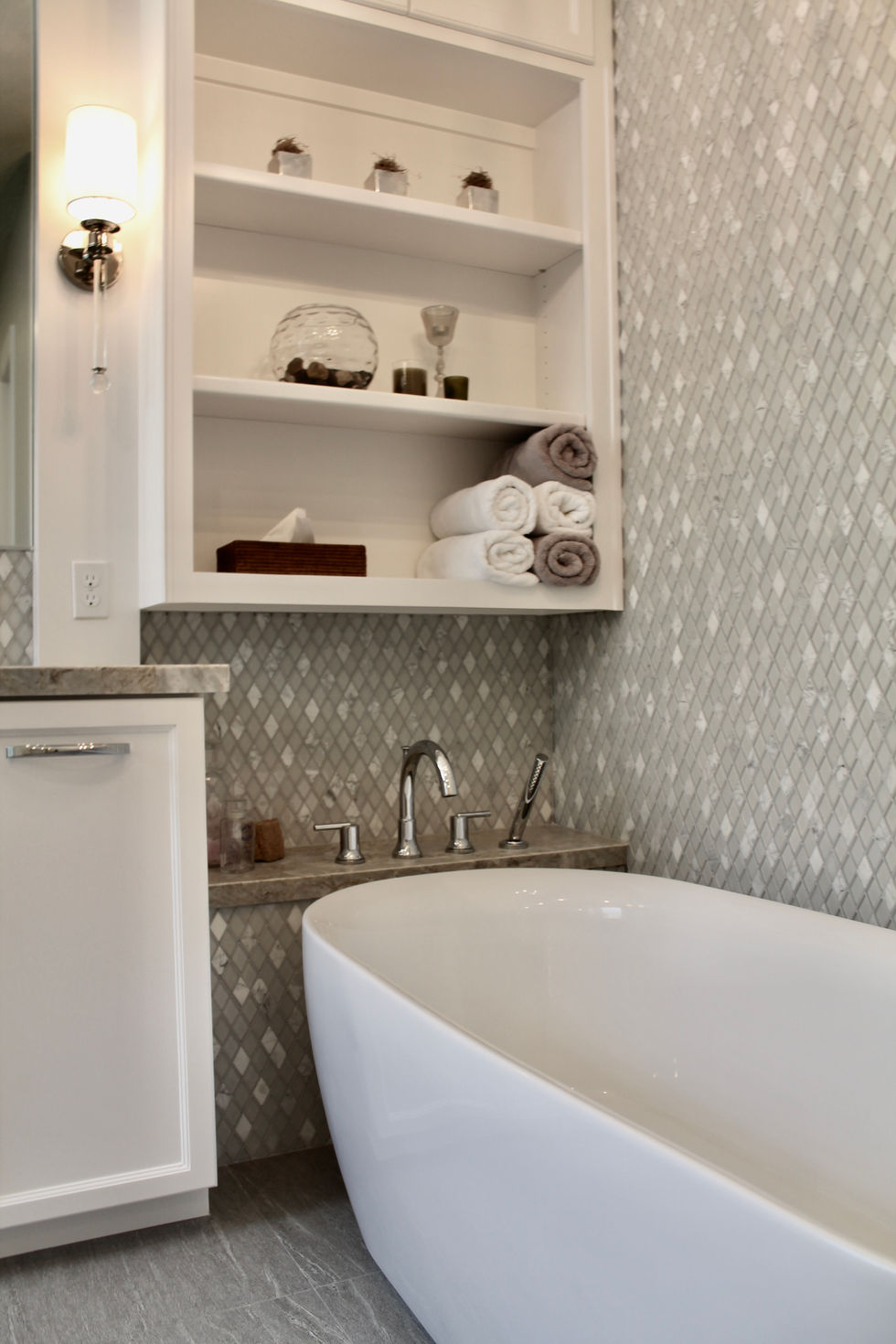 Freestanding Tub, Storage, White Cabinets, Hamper in Vanity, Mosaic Wall Tile, Polished Nickel Fixtures, Quartzite Countertops, Natural Stone Countertops, Large Format Floor Tile, Curbless Shower, Grab Bars, Hidden Shower Niche, Large Custom Mirrors, Sconces, Vanity, Make Up area, Storage, Drawers under Sink, Shower Body Sprayers