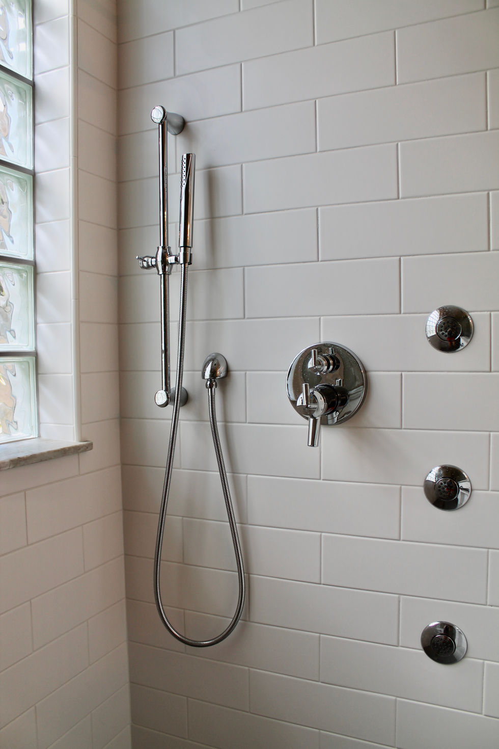 Freestanding Tub, Storage, White Cabinets, Hamper in Vanity, Mosaic Wall Tile, Polished Nickel Fixtures, Quartzite Countertops, Natural Stone Countertops, Large Format Floor Tile, Curbless Shower, Grab Bars, Hidden Shower Niche, Large Custom Mirrors, Sconces, Vanity, Make Up area, Storage, Drawers under Sink, Shower Body Sprayers