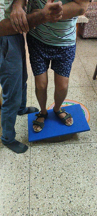 Stroke patient doing balance exercise at home set up