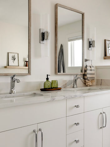 Mosaic tile shower floor detail in modern spa-inspired ensuite in Calgary