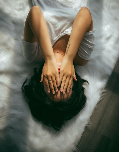 a woman holds her hands over her face_edited.jpg