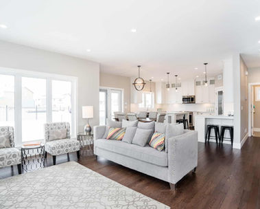 Open living area with large windows and abundant sunlight