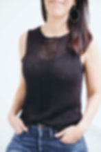 Thumbnail: Dark haired woman wearing a hand-knitted linen tank top, black and sleeveless