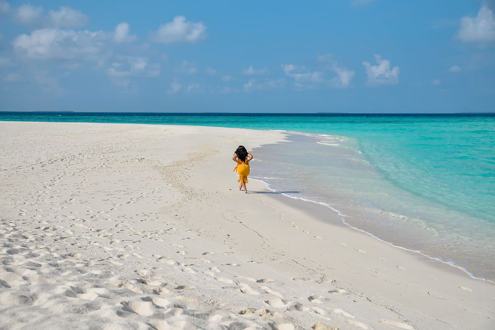 Salt-kissed air. Sand silk beneath bare feet. The hush of waves as the camera clicks. This isn’t a vacation—it’s a solo ritual. CREDIT: BRITNEE JOHNSON/THE GREATEST ASSIST