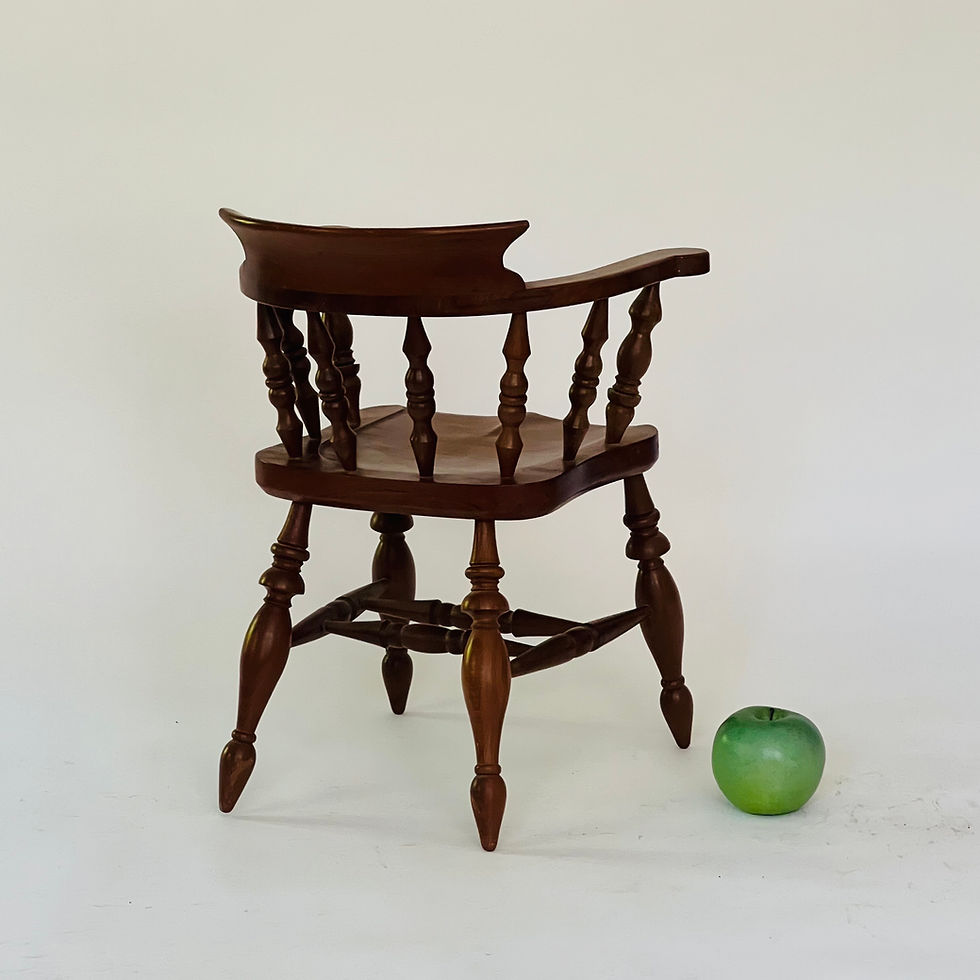 Thumbnail: A vintage model of a captain's chair.