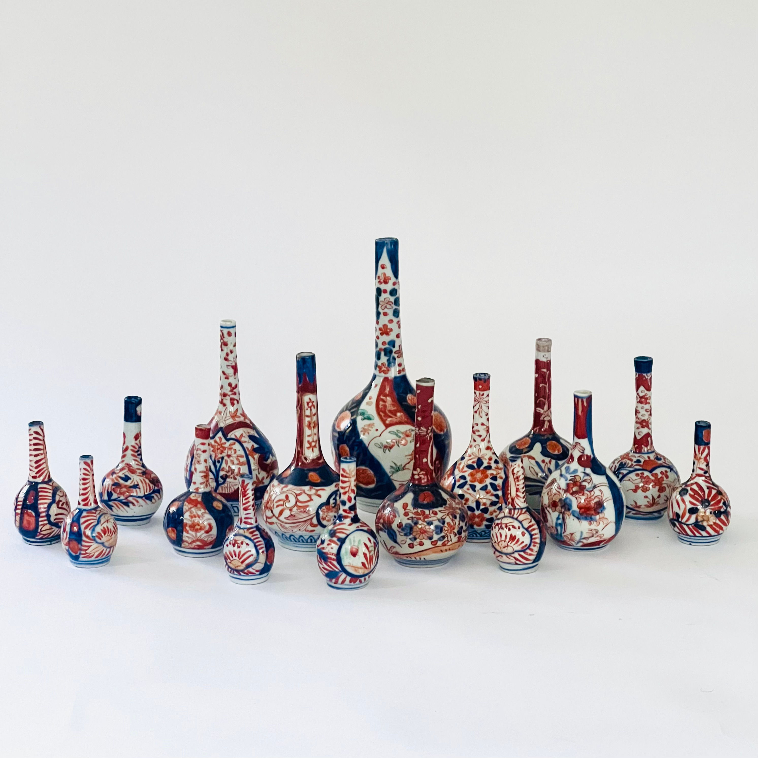 A large collection of Imari bottle vases.
