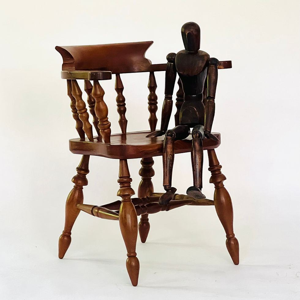 Thumbnail: A vintage model of a captain's chair.
