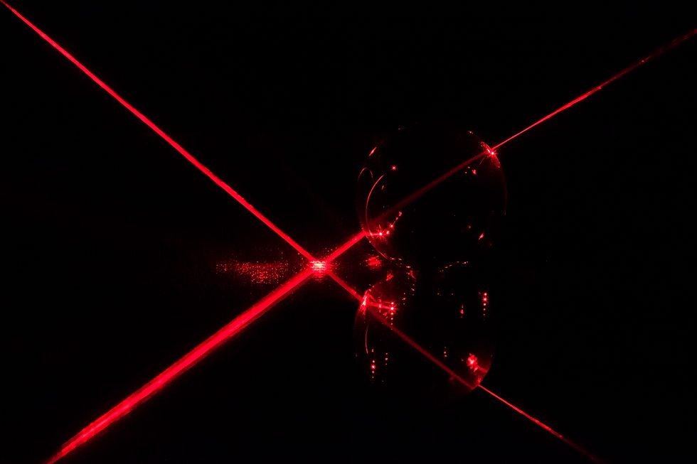vecteezy_red-laser-beam-reflecting-on-a-mirror_24936615.jpg